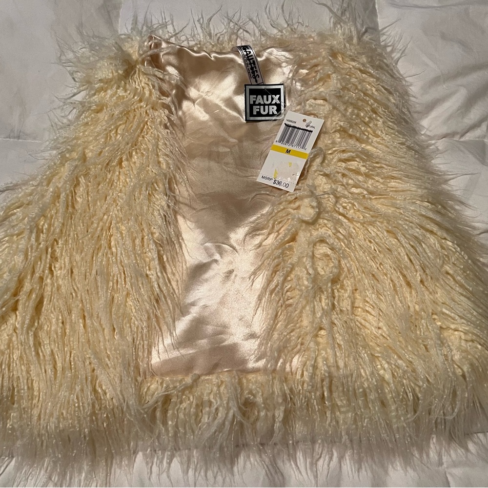 Cream colored faux fur vest